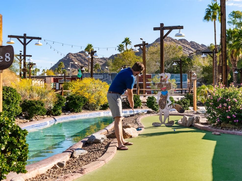 Adult playing putt putt at River Ranch Water park
