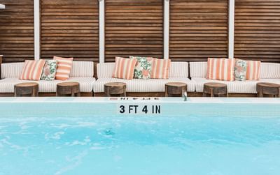 Pool sun loungers with rooftop screen at Esme Miami Beach