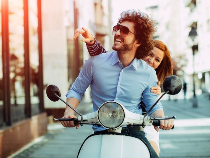 cheerful couple on bike