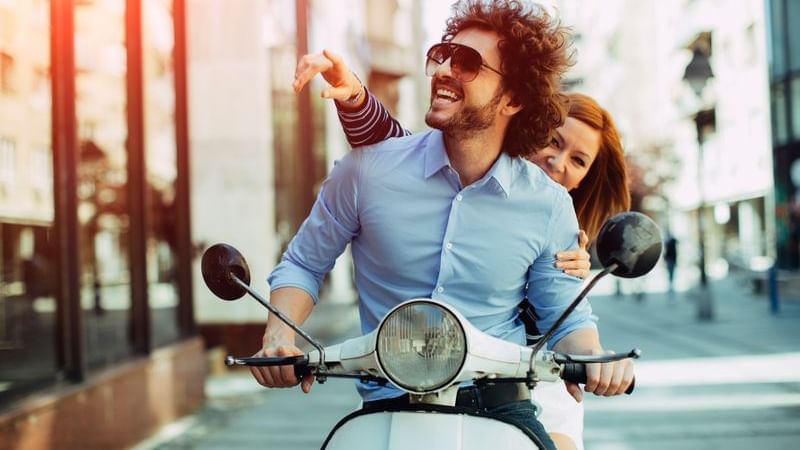 cheerful couple on bike