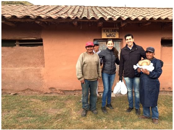 Foreigners taking a picture with local people near Hotel Sumaq