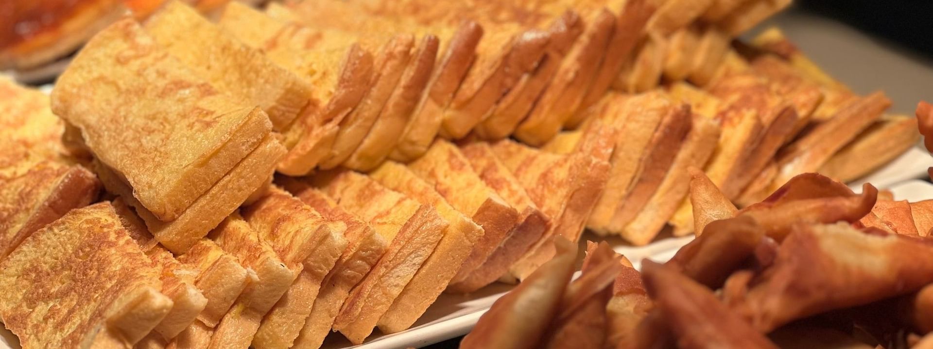 Plates of french toast and crispy bread at Bula Brasserie, Warwick Fiji Resort and Spa, Korolevu