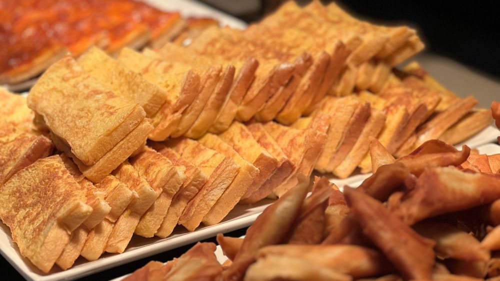 Plates of french toast and crispy bread at Bula Brasserie, Warwick Fiji Resort and Spa, Korolevu.