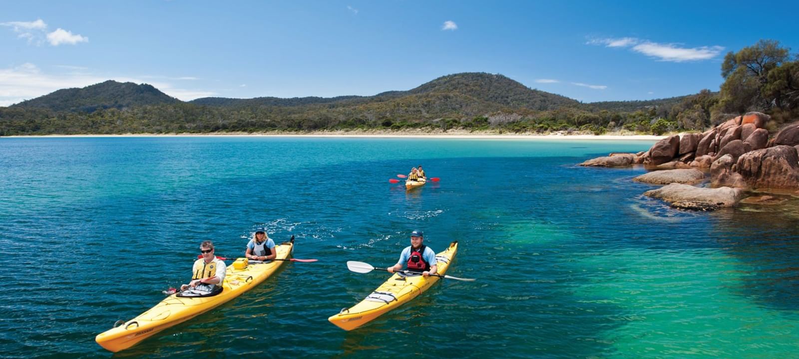 People Kayaking on the Great Oyster Bay near Freycinet Lodge