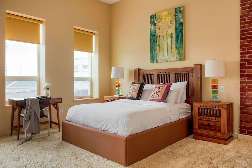 King bed, bedside cupboard with lamps & work desk in Queen Premiere Mellow at Retro Suites Hotel