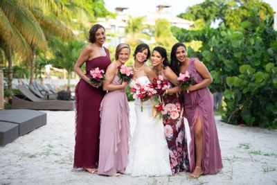 The Bridal party posing for a picture at True Blue Bay Hotel