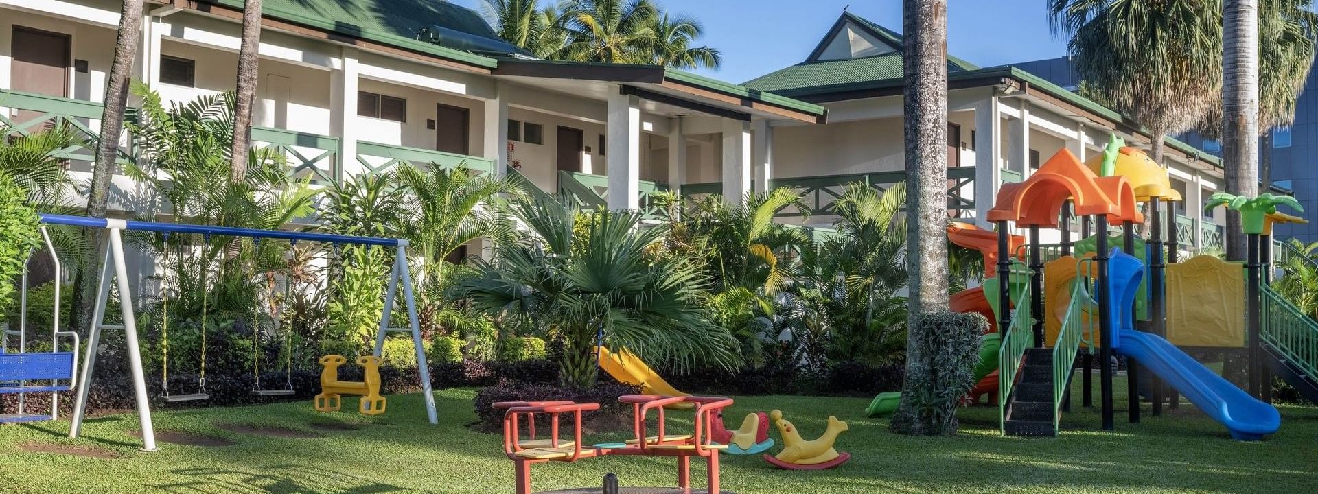 Colorful playground with slides, swings, and merry-go-round at Tokatoka Resort - Fiji International Airport, Nadi