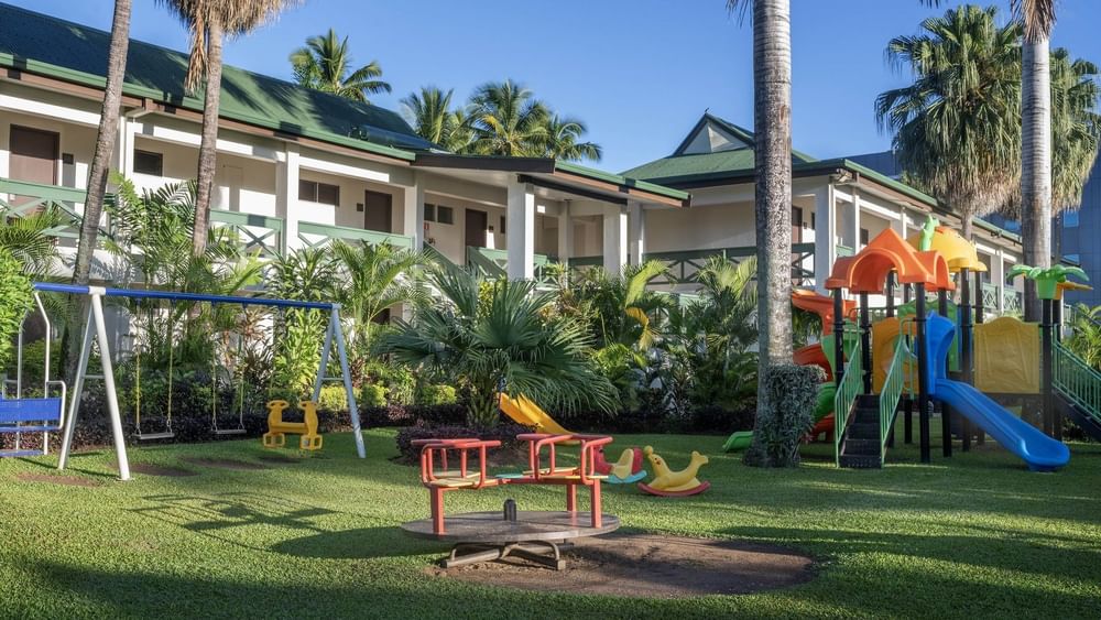 Colorful playground with slides, swings, and merry-go-round at Tokatoka Resort - Fiji International Airport, Nadi.