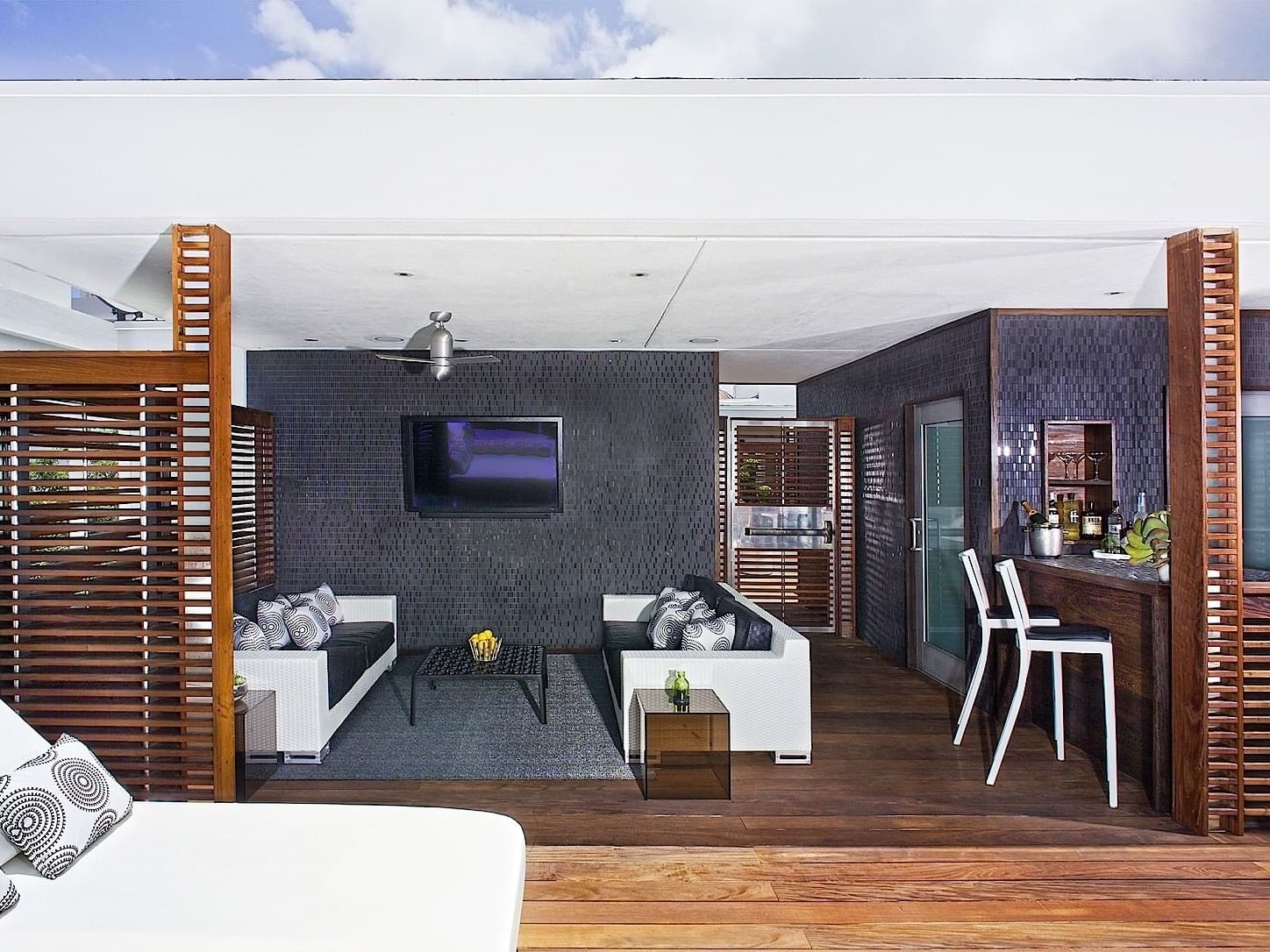 Sun House living & bar area with sunbeds at Dream South Beach