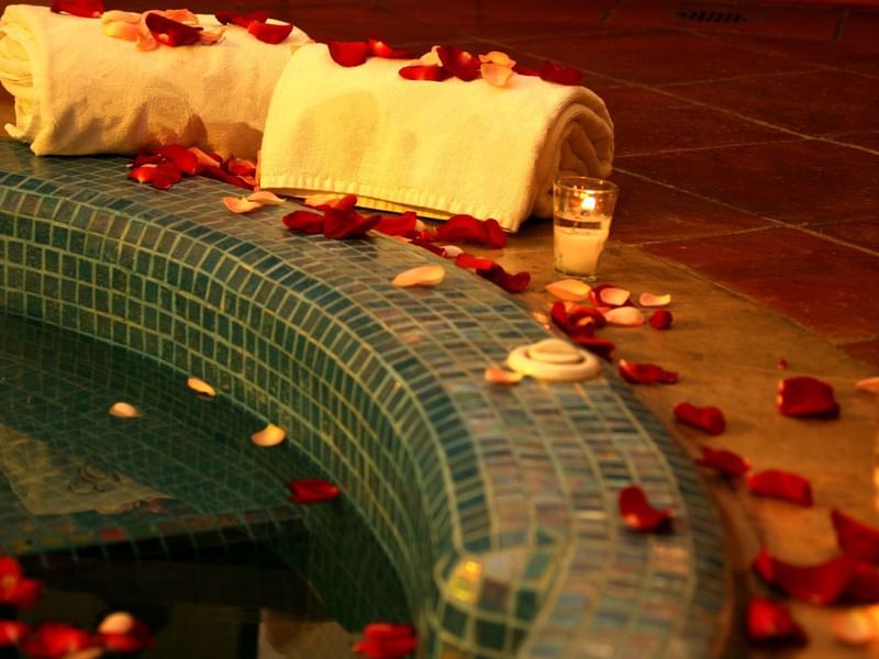 Spa Jacuzzi with rose petals & candles at La Colección Resorts