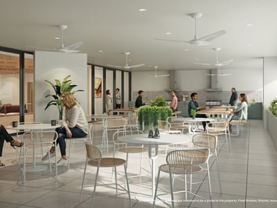 People sitting at tables in the UniLodge Brisbane City open-air dining area.