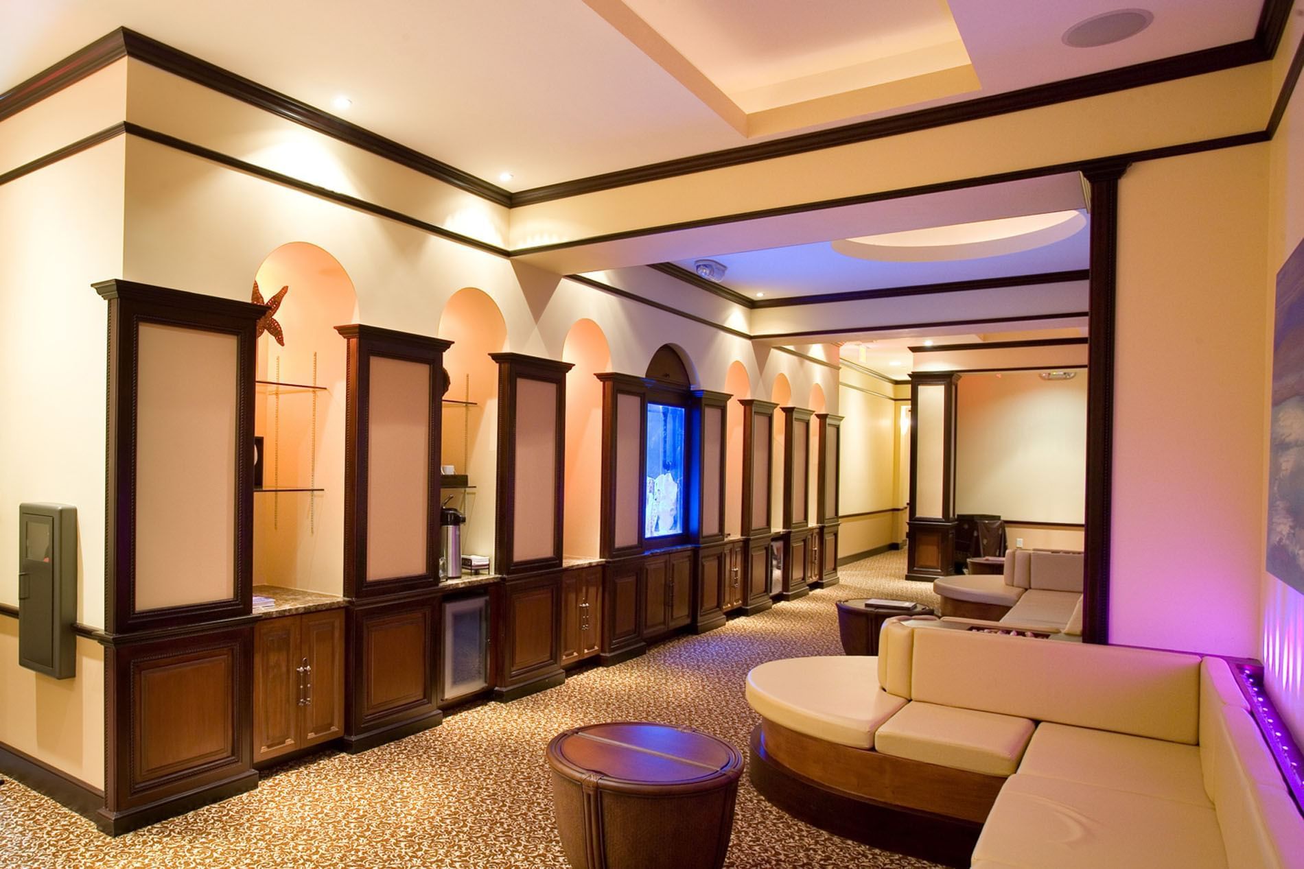 Reflections Spa & Salon interior with curved sofas at Lake Buena Vista Resort Village & Spa
