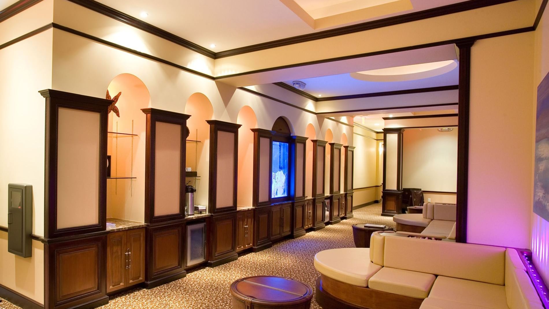 Reflections Spa & Salon interior with curved sofas at Lake Buena Vista Resort Village & Spa