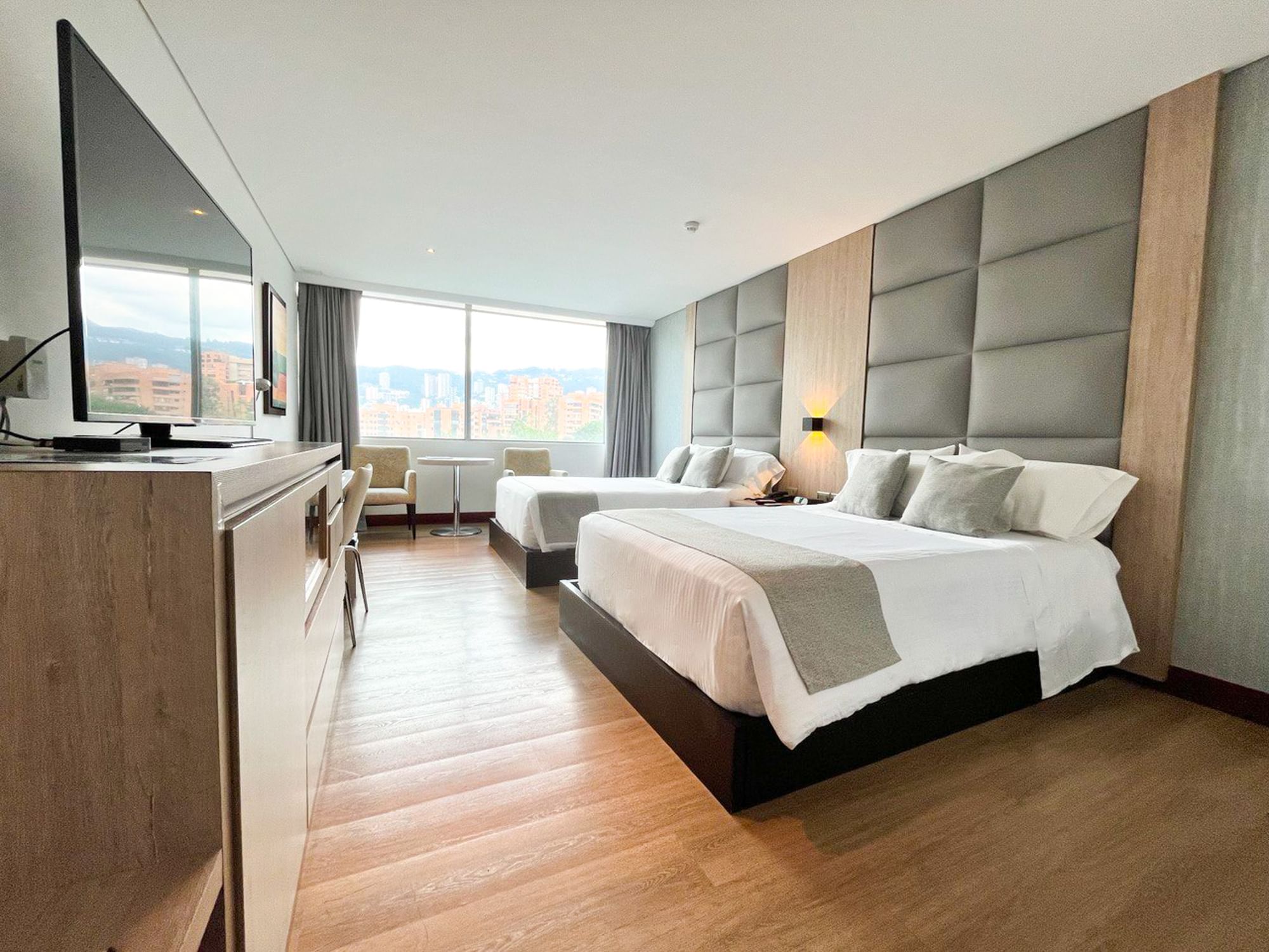 Twin Room with beds and TV area at San Fernando Plaza Hotel