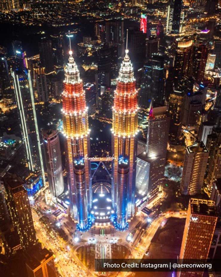 Aerial view of The Petronas Twin Towers, famous twin skyscrapers near Imperial Lexis Kuala Lumpur