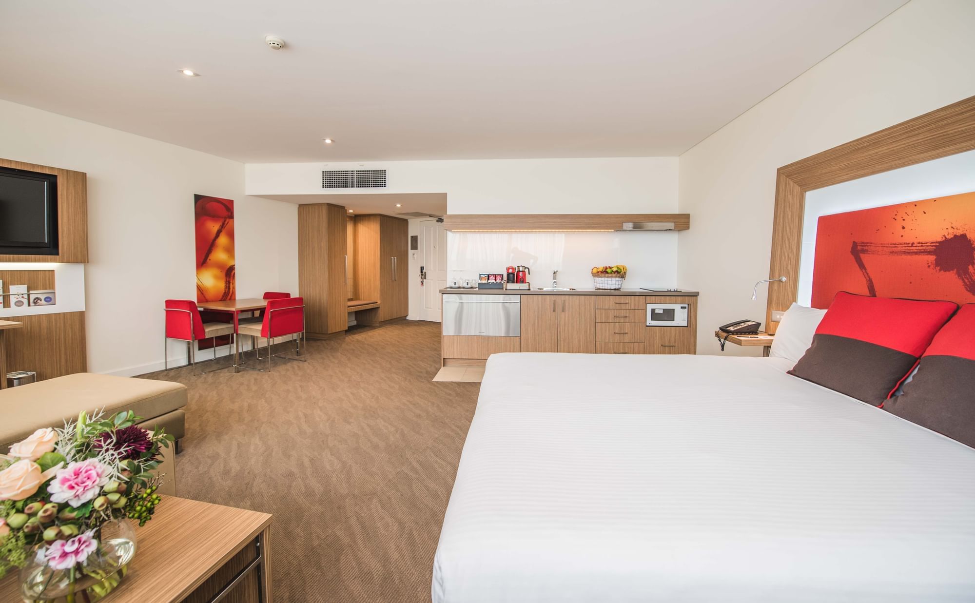 Interior of the Deluxe suite with king bed at Novotel Sydney