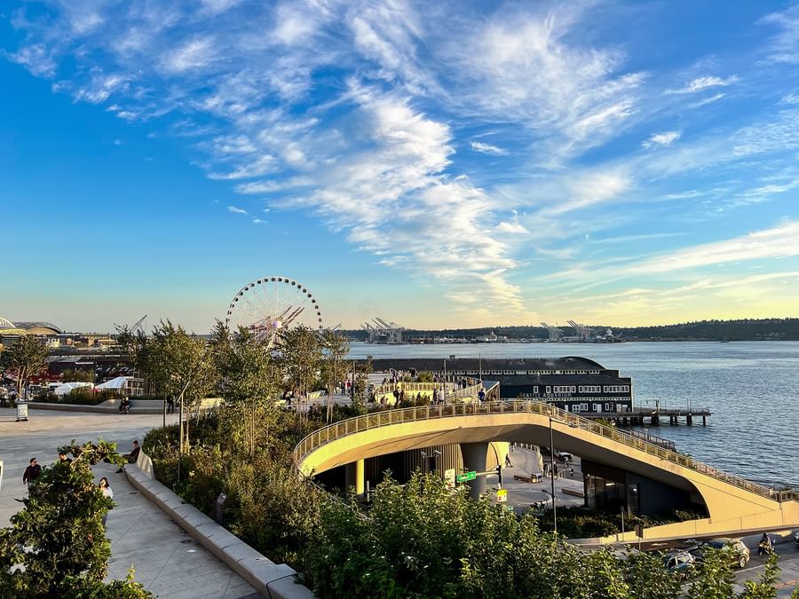 The Great Wheel by the waterfront and city pier under a blue sky near Warwick Seattle
