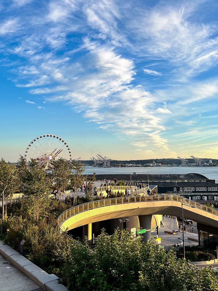 The Great Wheel by the waterfront and city pier under a blue sky near Warwick Seattle