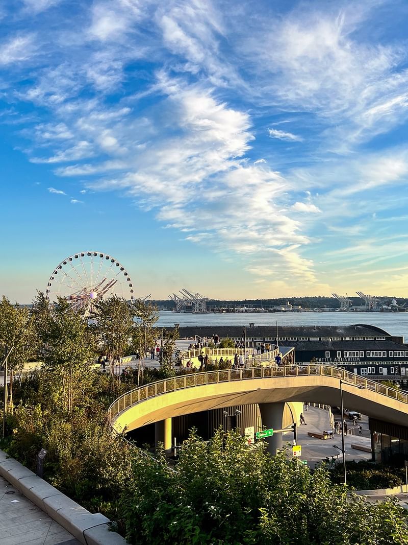 The Great Wheel by the waterfront and city pier under a blue sky near Warwick Seattle