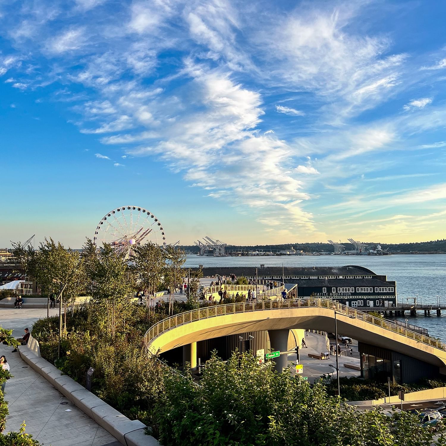 The Great Wheel by the waterfront and city pier under a blue sky near Warwick Seattle