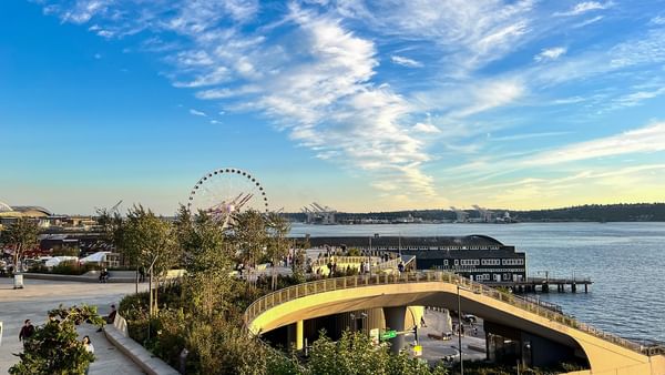 The Great Wheel by the waterfront and city pier under a blue sky near Warwick Seattle