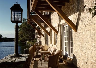Patio lounge area with river view at The Herrington Inn & Spa