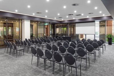 Theatre chairs in Bridge & Yarra Room at Amora Hotel Melbourne