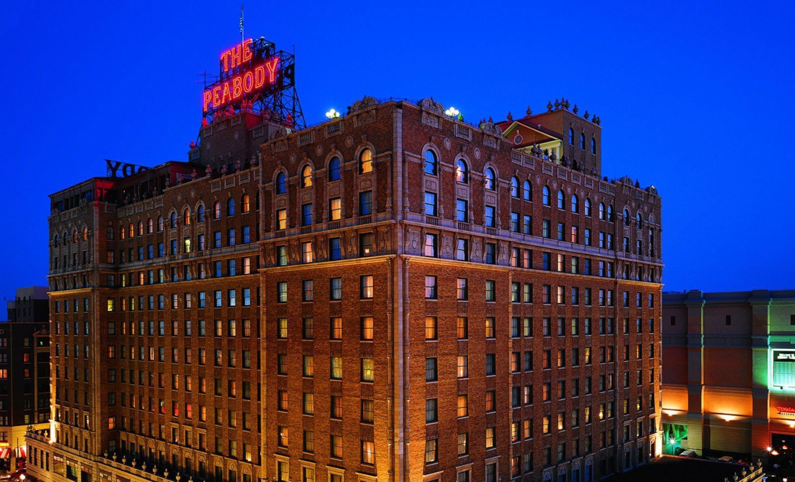 An exterior view of The Peabody Memphis hotel at night
