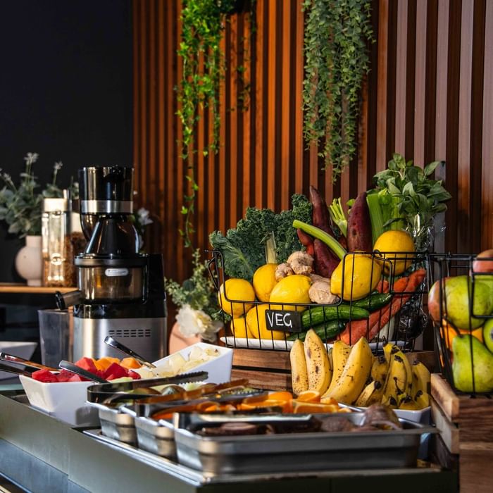 Buffet Breakfast station with fresh fruits, vegetables, and a juicer at Mercure Kooindah Waters