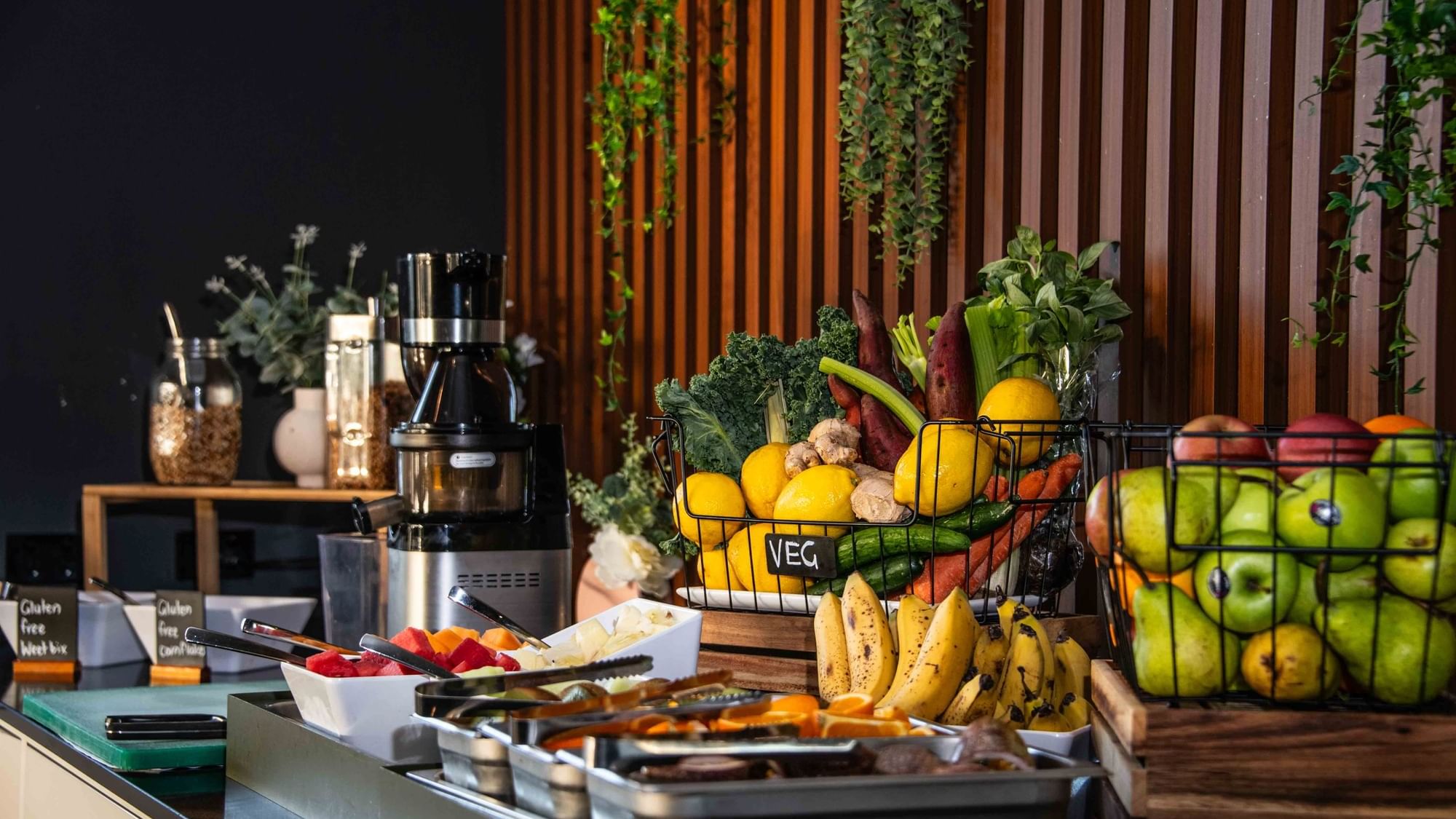 Buffet Breakfast station with fresh fruits, vegetables, and a juicer at Mercure Kooindah Waters