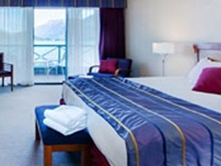 Cozy bed in East Tower: Mountain View King at Harrison Hot Springs Resort 