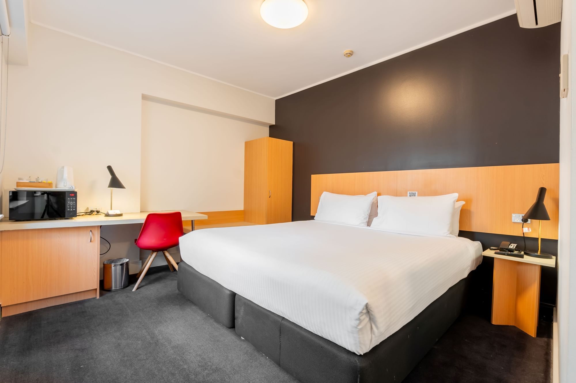 King room with king sized bed, desk and chair