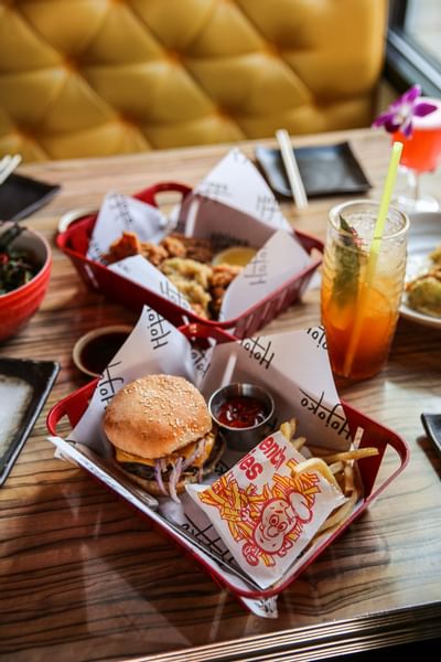 Cheeseburger and cocktail served with fries in Hojoko near The Verb Hotel