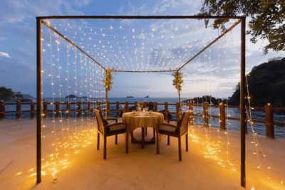 Romantic dinner table set-up with lights at Cala de Mar