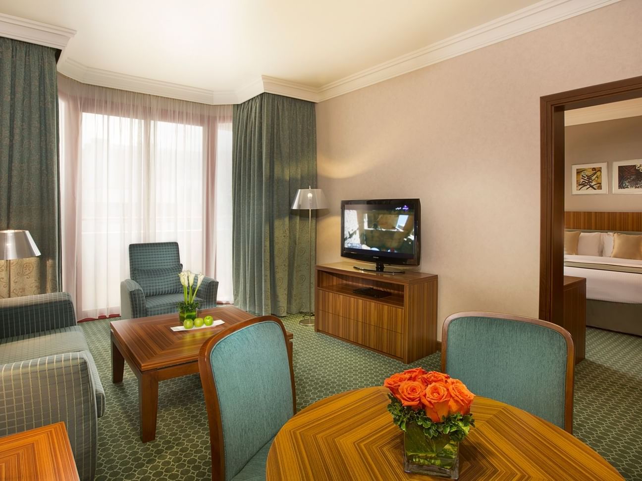 TV lounge area in Deluxe Family Suite at City Seasons Hotels