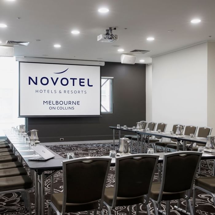 U-shaped table setup for event at Novotel Melbourne on Collins