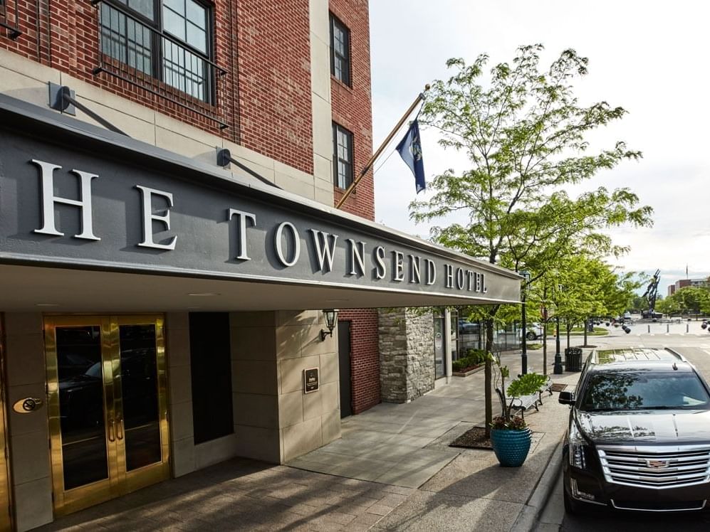 A car parked in front of the entrance at The Townsend Hotel