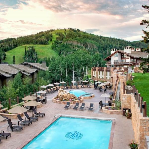 Outdoor Pool overlooking mountains at Stein Lodge at sunset
