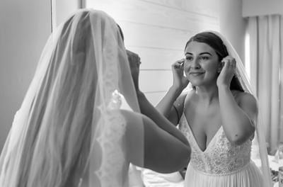 A bride looks at herself in the mirror at Bougainvillea Barbados