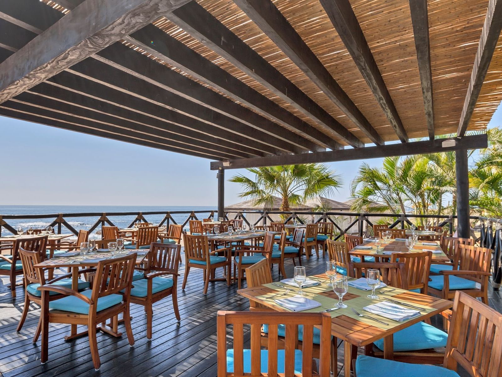 Open & airy dining area with a sea view at La Colección Resorts