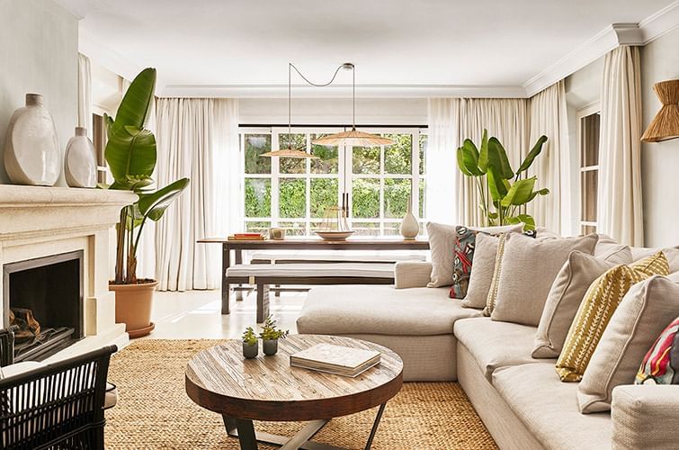 Living area with a fireplace at a room in Marbella Club