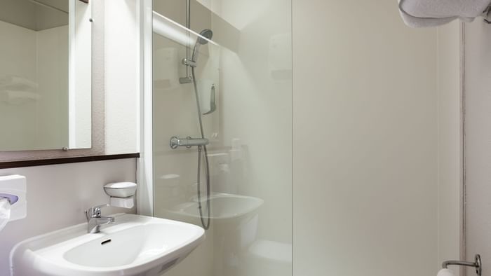 Bathroom vanity in bedrooms at Hotel du Phare