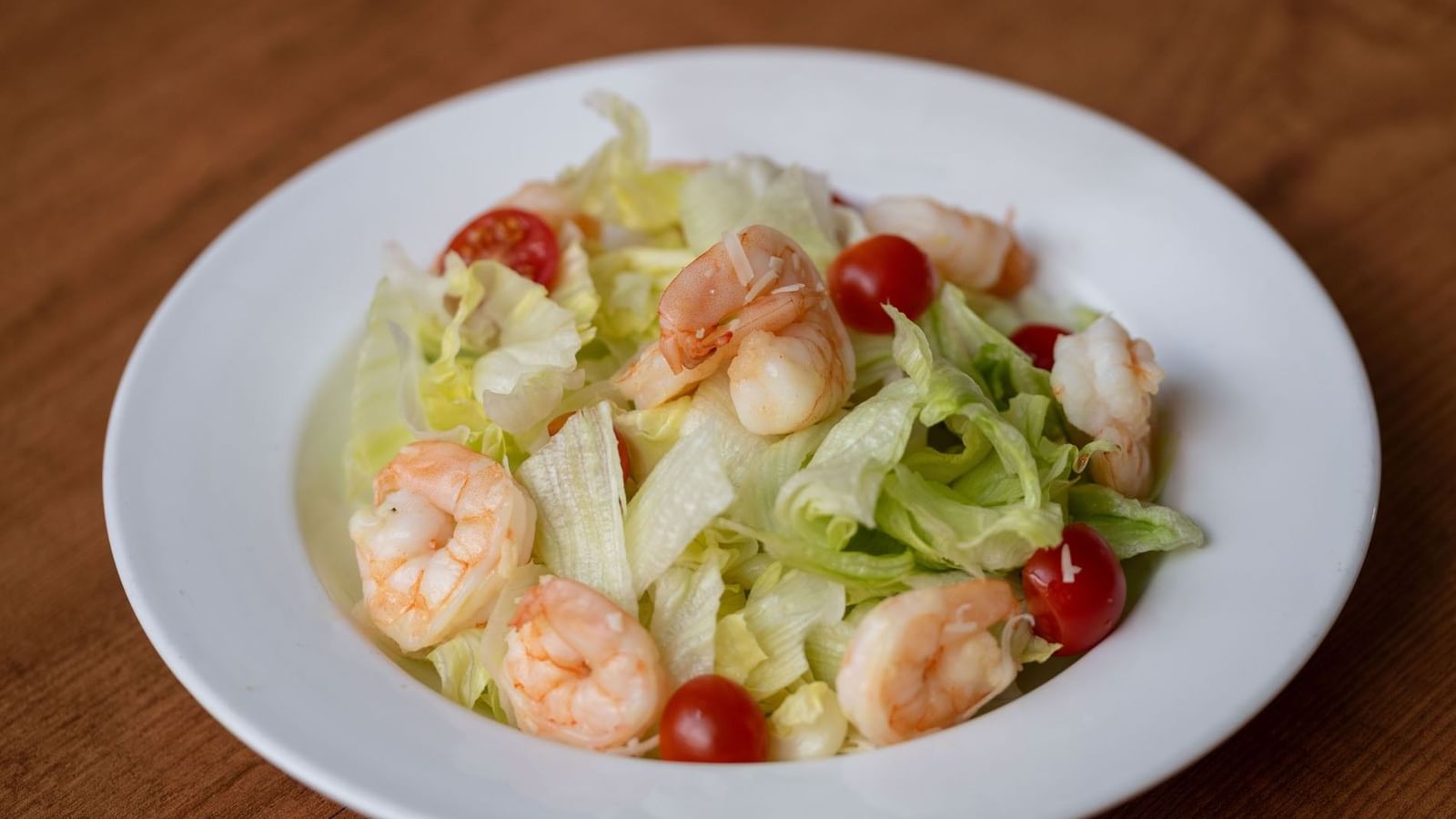 Fresh salad with shrimp, cherry tomatoes, and lettuce served in the Seasons Restaurant at Warwick Hotel Jeddah
