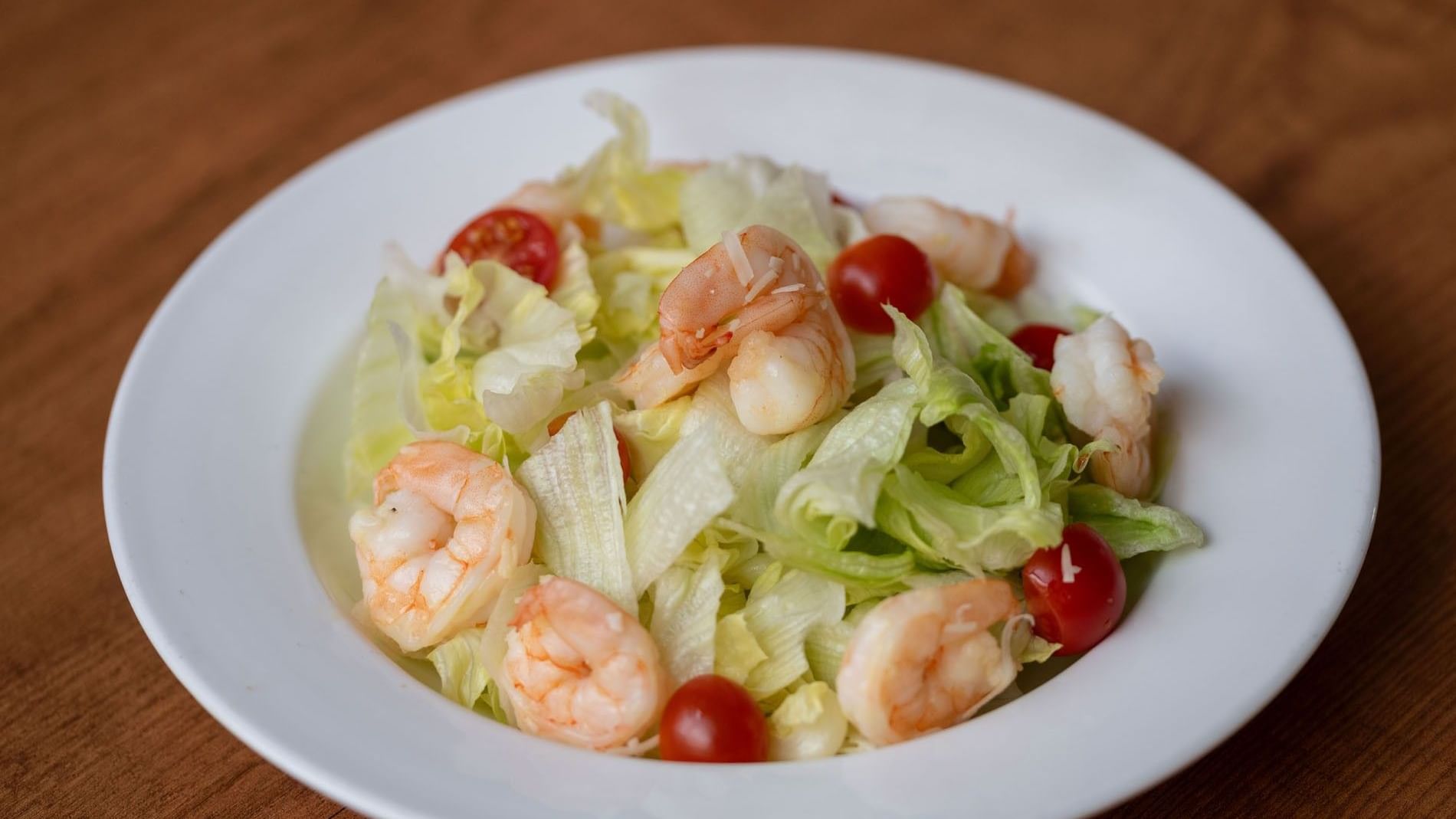 Fresh salad with shrimp, cherry tomatoes, and lettuce served in the Seasons Restaurant at Warwick Hotel Jeddah