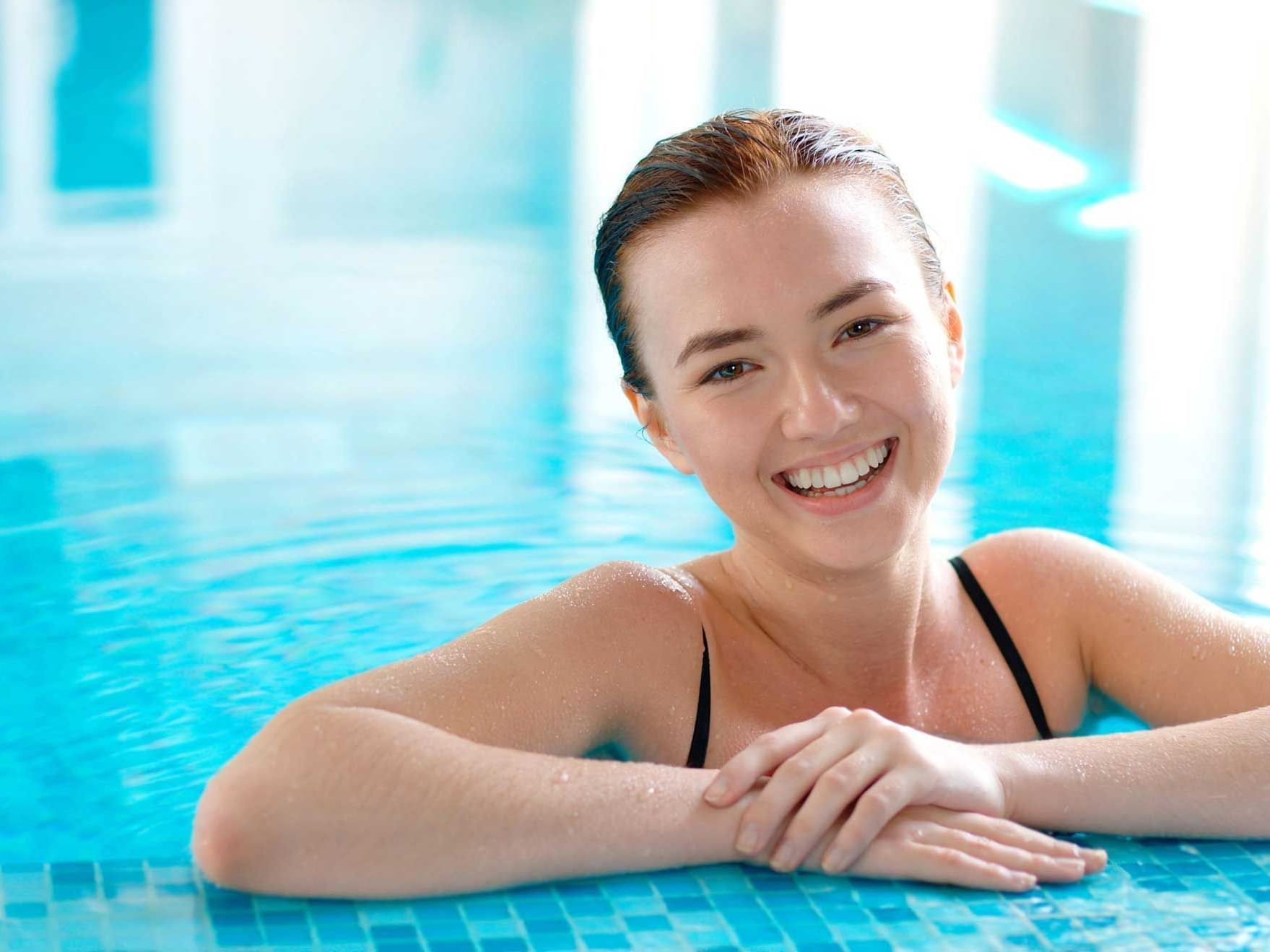 Closeup of a Lady smiling in the pool at Artyzen Grand Lapa