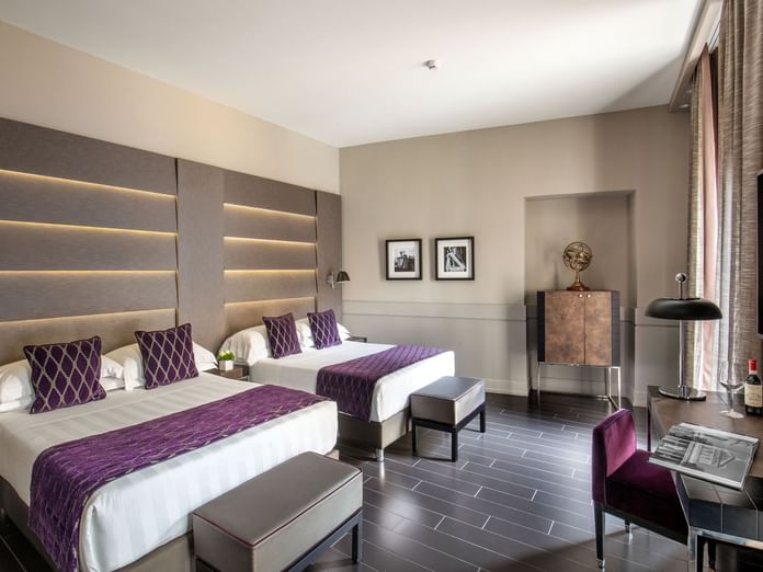 Interior of Junior Suite with a working space by the double king beds overlooking the window view at The Style