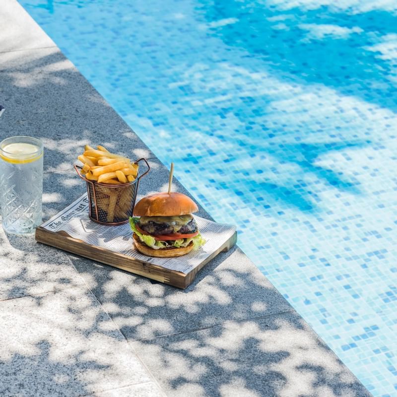 Burger & fries by the swimming pool at Crown Promenade Perth