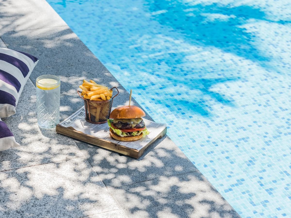 Burger & fries by the swimming pool at Crown Promenade Perth