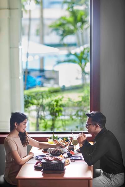 Couple enjoying their meal at Hanoi Daewoo Hotel