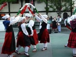 A group of women dancing in the festival near Hotel 43